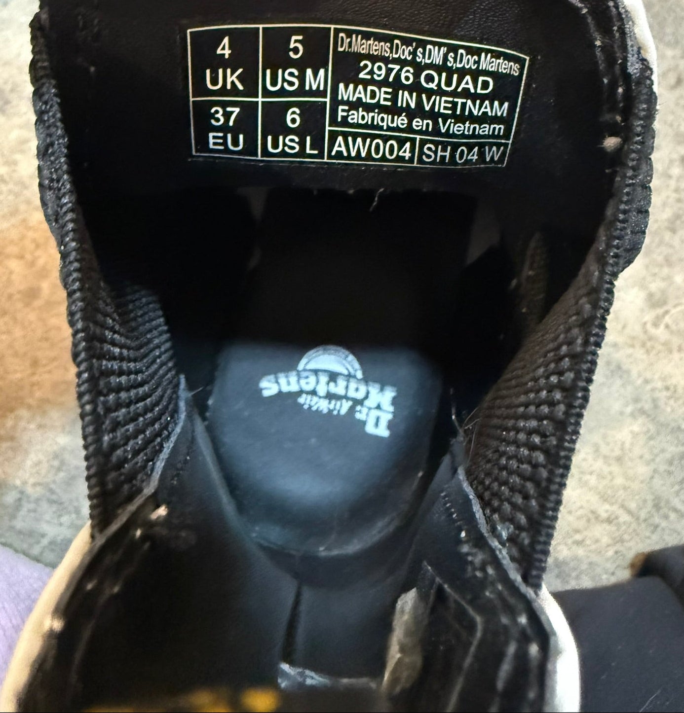 Close-up of a shoe label with size and brand information.