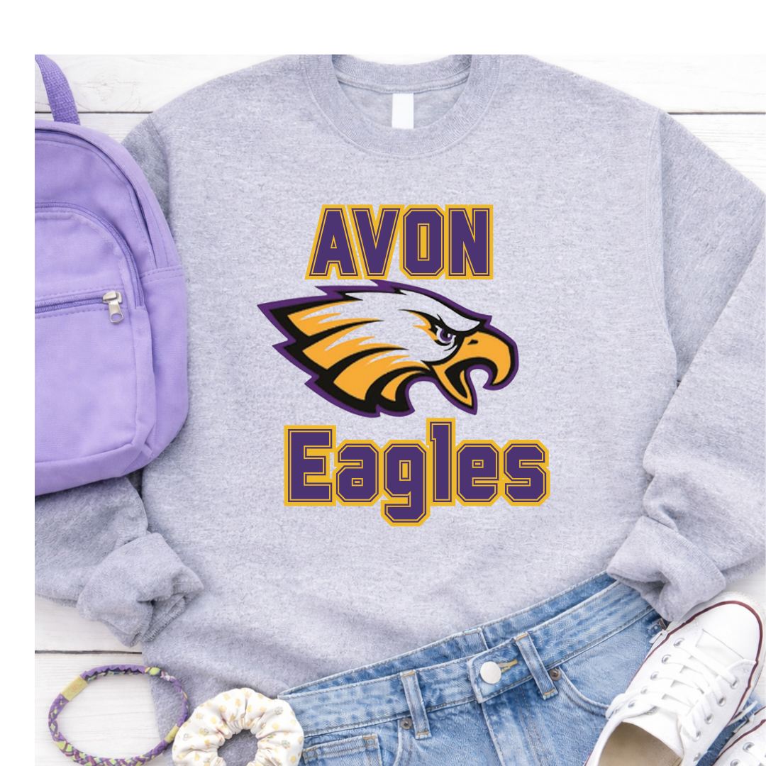 Gray sweatshirt with 'Avon Eagles' logo, purple backpack, white sneakers, and blue jeans on a white background