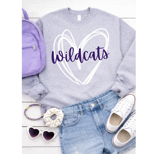 Gray sweatshirt with 'Wildcats' design, purple backpack, denim shorts, white sneakers, scrunchie, sunglasses on a white background.